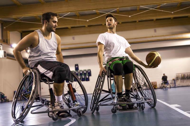 wheelchair sports, student playing basketball